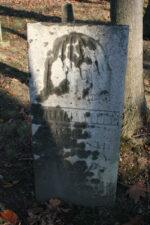 William Young's tombstone featured an engraving of a person crying beneath a tree. William died on March 31, 1854.