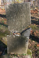 The somewhat repaired tombstone of John Young. Born on December 8, 1844, John was only seven-years-old when he died on January 27, 1852.